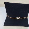 Bracelet fin doré avec papillon pavé strass central et oxydes de zirconium ronds serties sans nickel