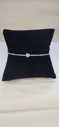 Bracelet tennis argenté pavé strass avec étoile centrale en strass sans nickel